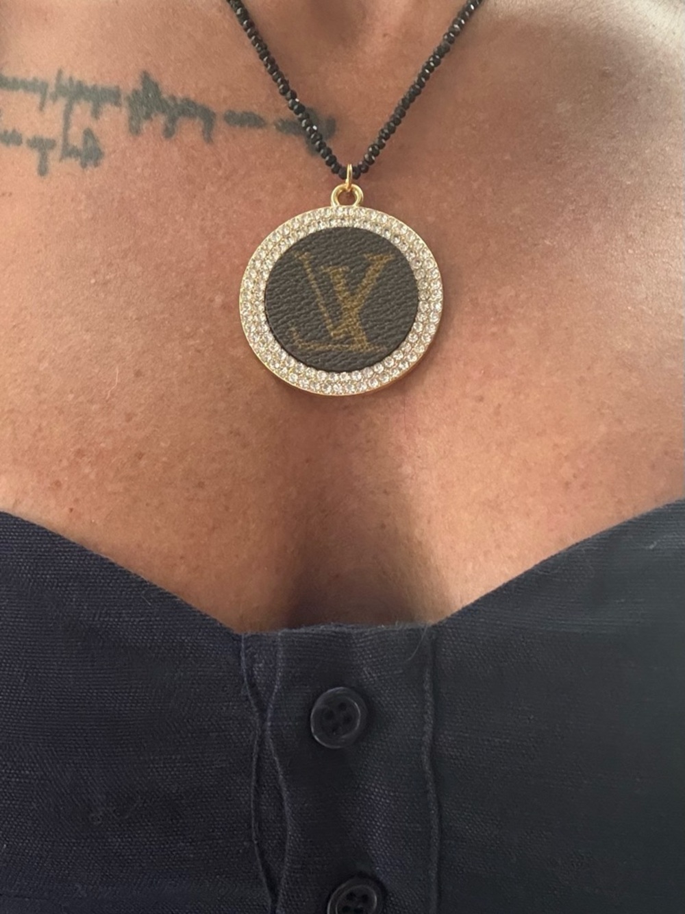 Boutique beaded necklace with Louis Vitton  monogram.  This is NOT a LV